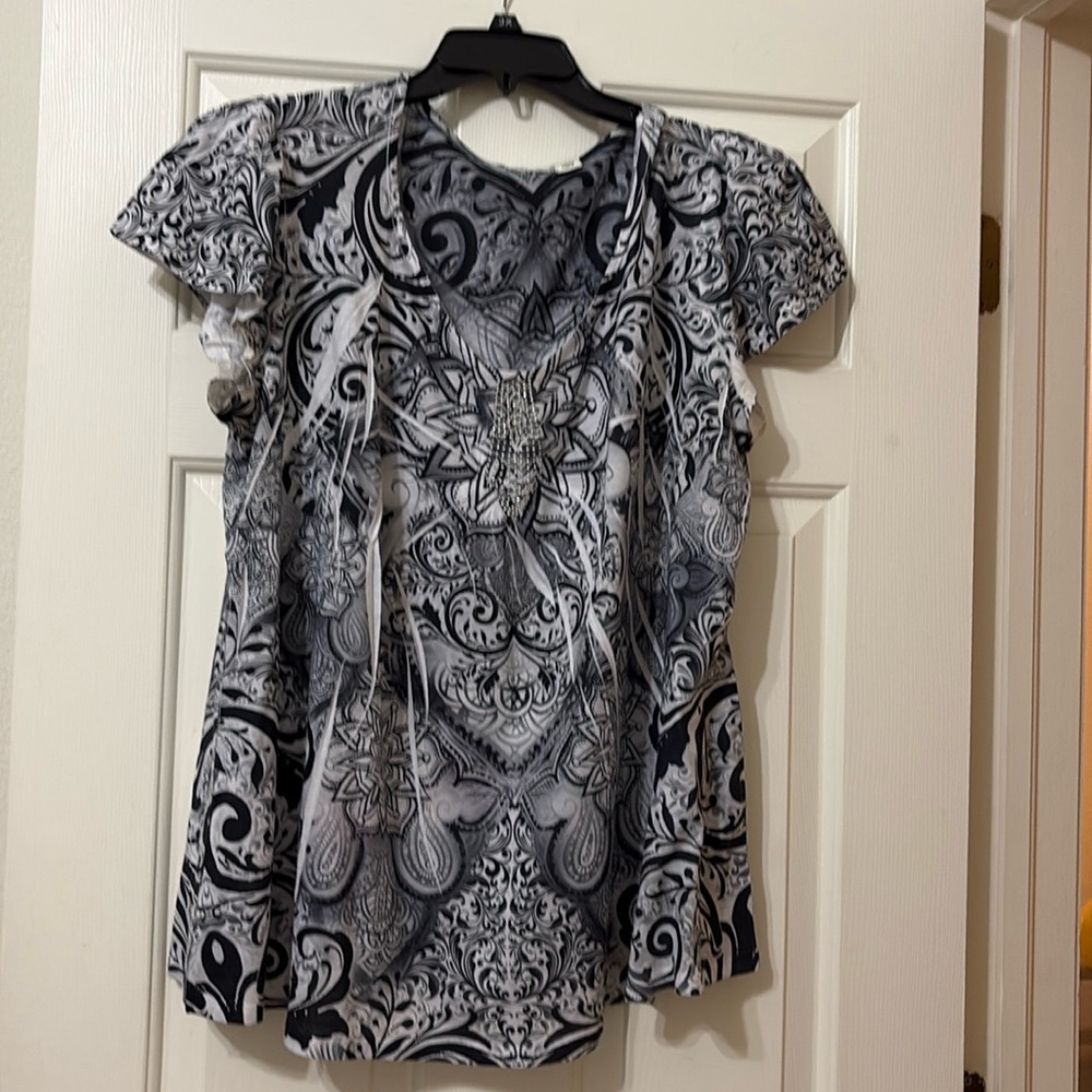 One world size 22/24, gray, and white with to it’s on the front